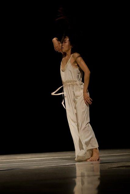 Tsai-Chin Yu in “"... como el musguito en la piedra, ay si, si, si ..." (Like Moss on the Stone)” by Pina Bausch with Tanztheater Wuppertal at Opernhaus Wuppertal (Germany), June 11, 2009