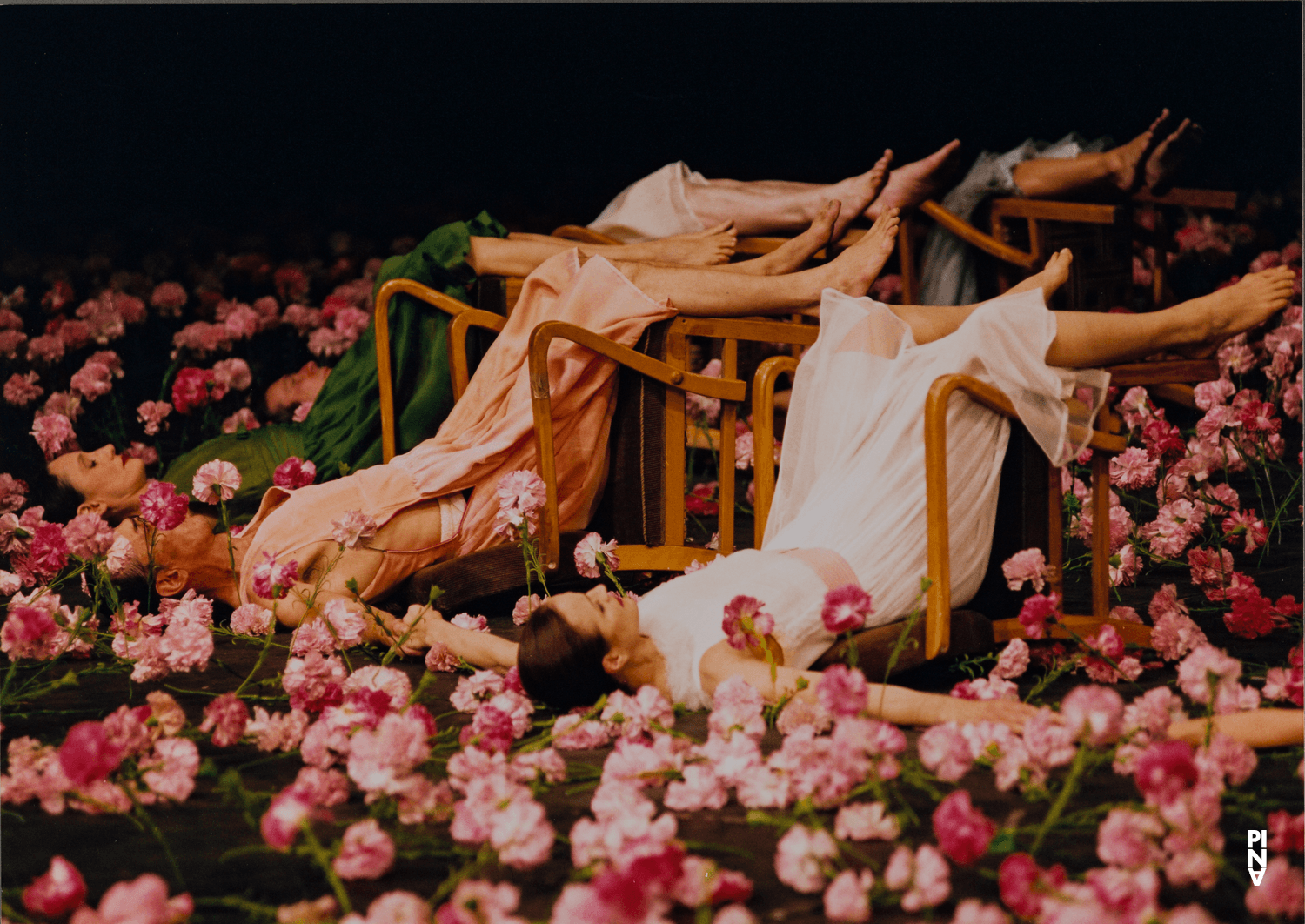 Julie Anne Stanzak, Jean Laurent Sasportes and Nazareth Panadero in “Nelken (Carnations)” by Pina Bausch
